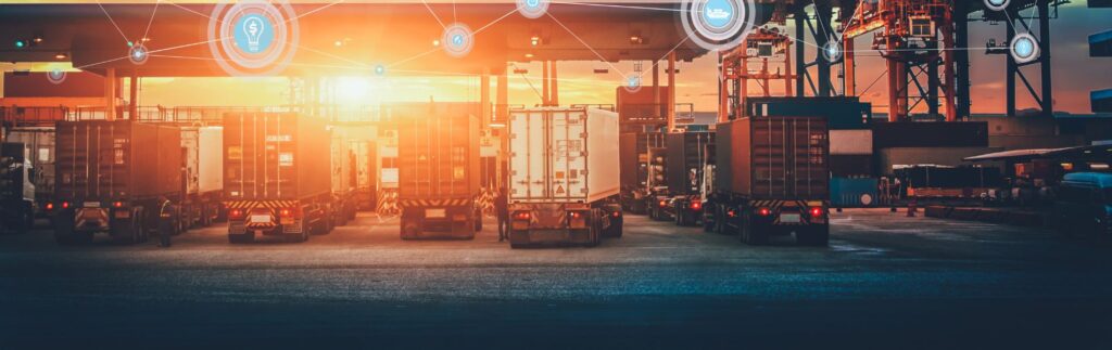 Logistyka i transport drogowy - zdjęcie przedstawiające ciężarówki 